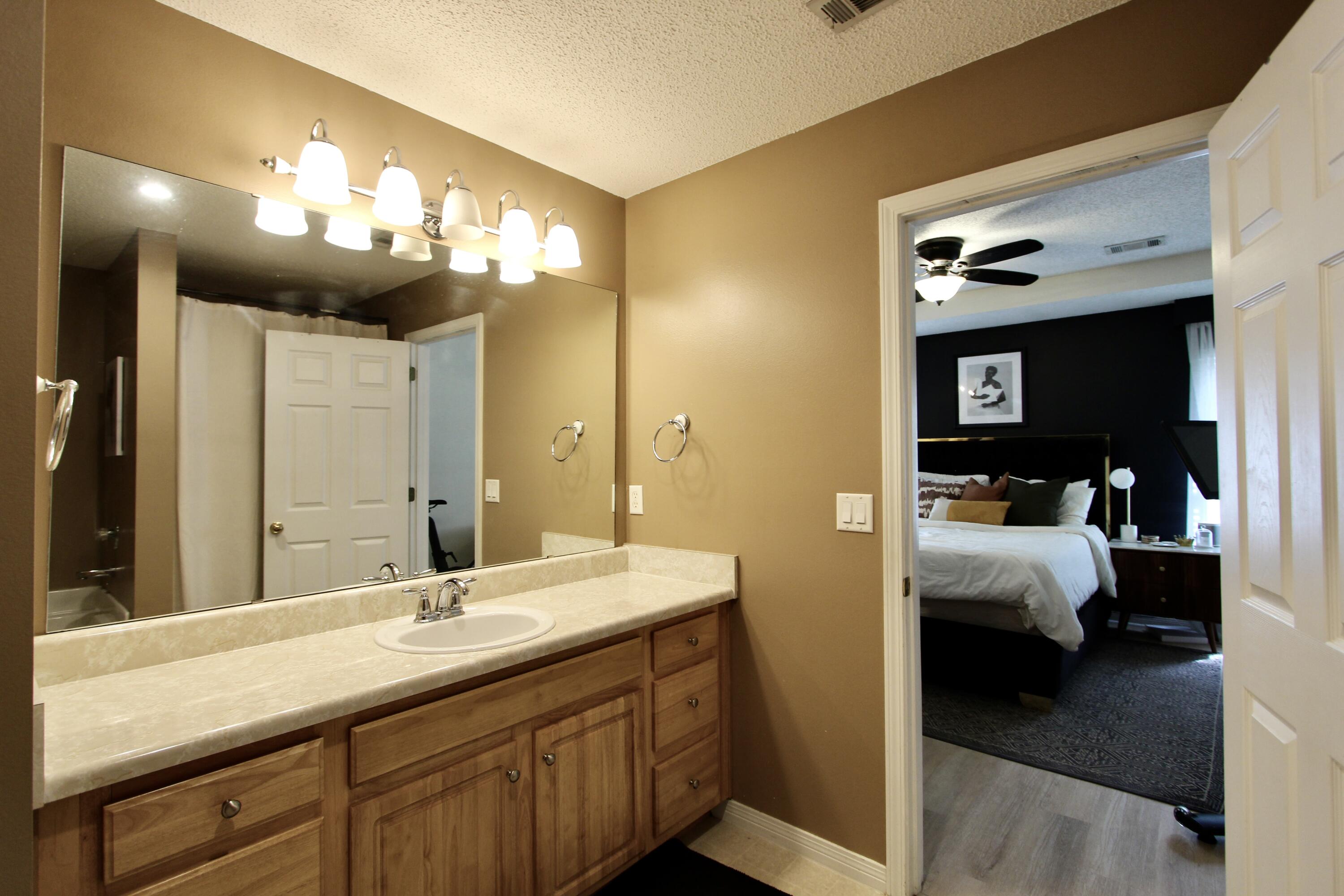 3150 Skyhawk Drive Crestview, FL 32539 - Photo 20 of 26 a en suite bathroom with a sink and a mirror