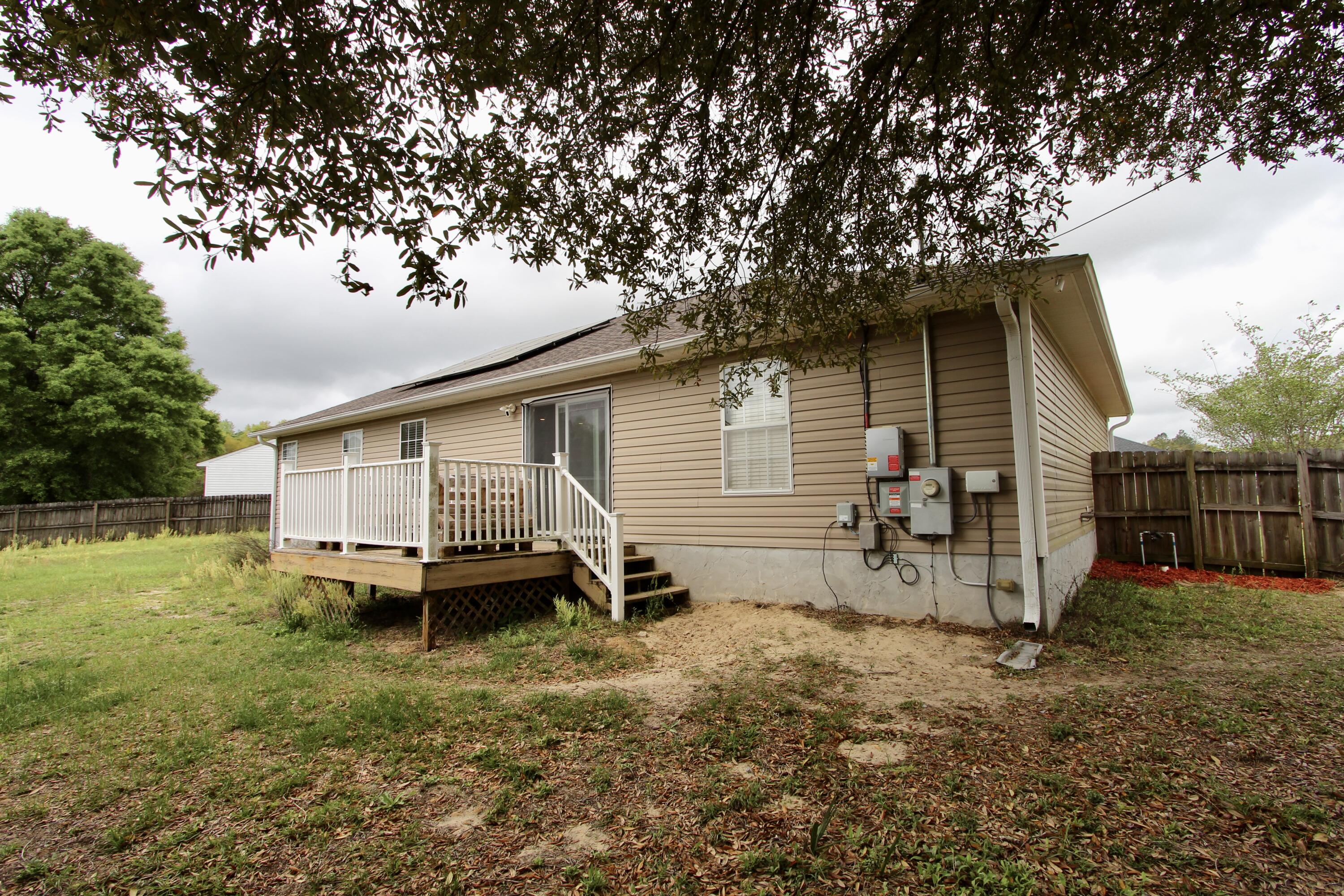 3150 Skyhawk Drive Crestview, FL 32539 - Photo 24 of 26 a view of a house with a backyard
