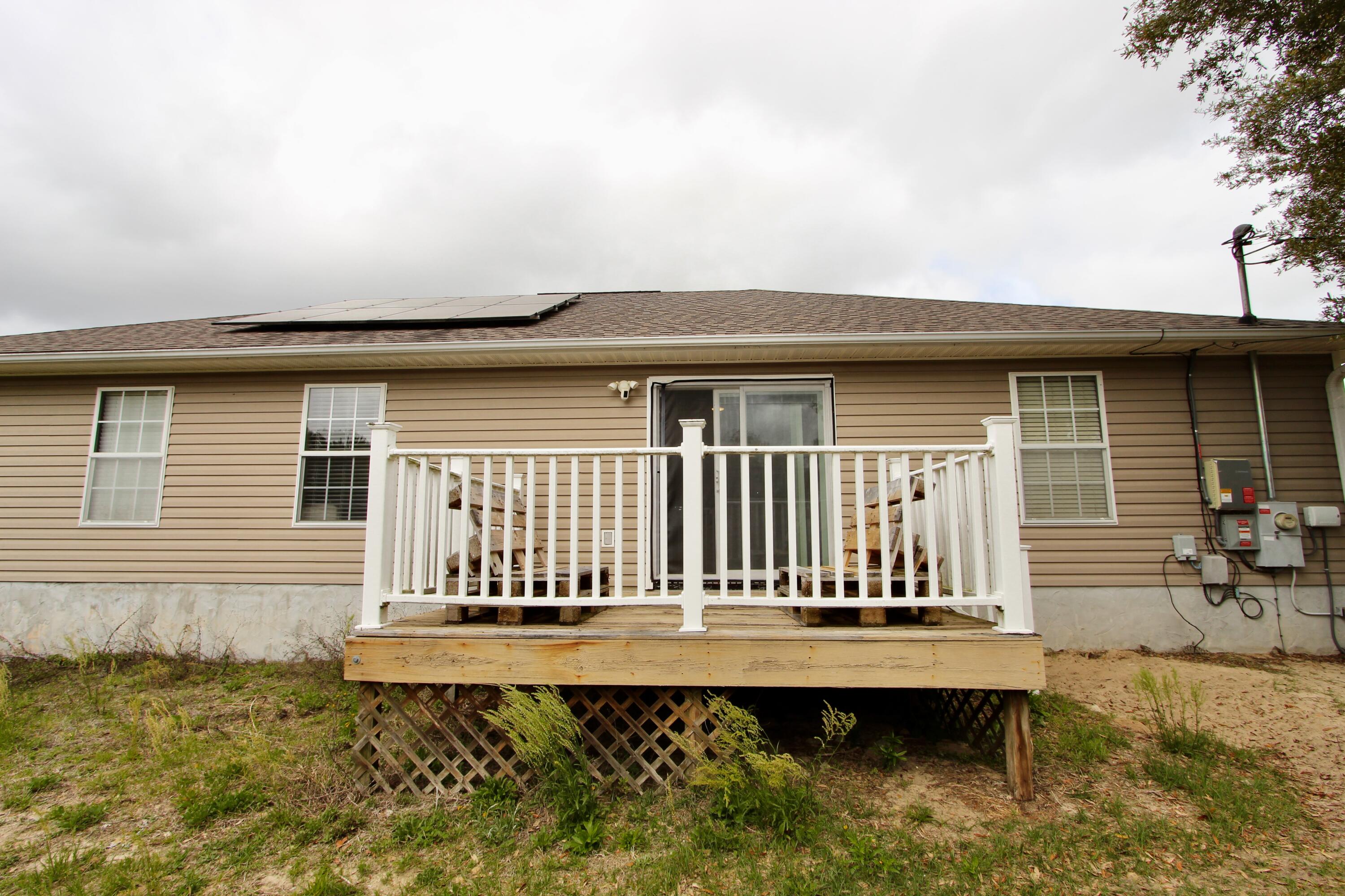 3150 Skyhawk Drive Crestview, FL 32539 - Photo 25 of 26 a front view of a house with a swimming pool