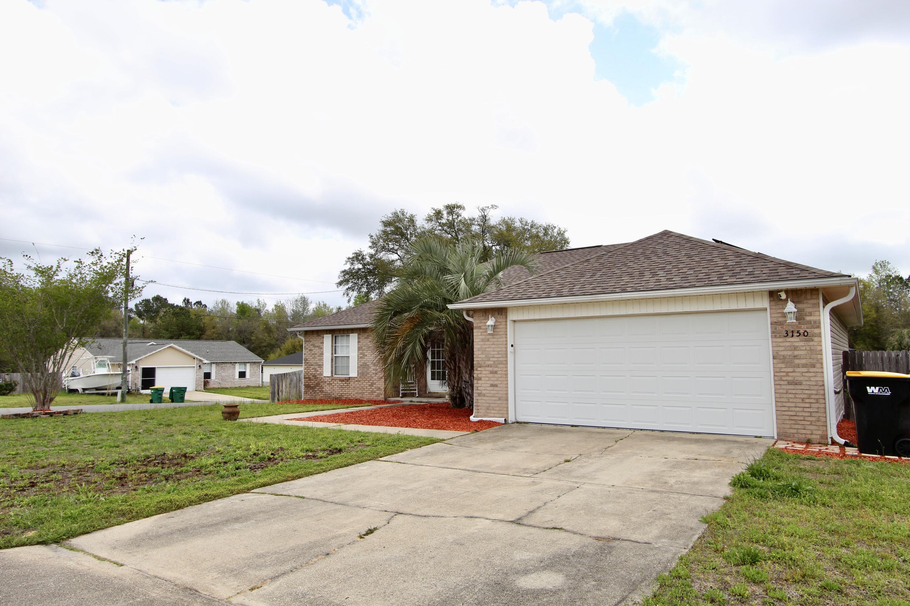 3150 Skyhawk Drive Crestview, FL 32539 - Photo 3 of 26 a front view of building with yard