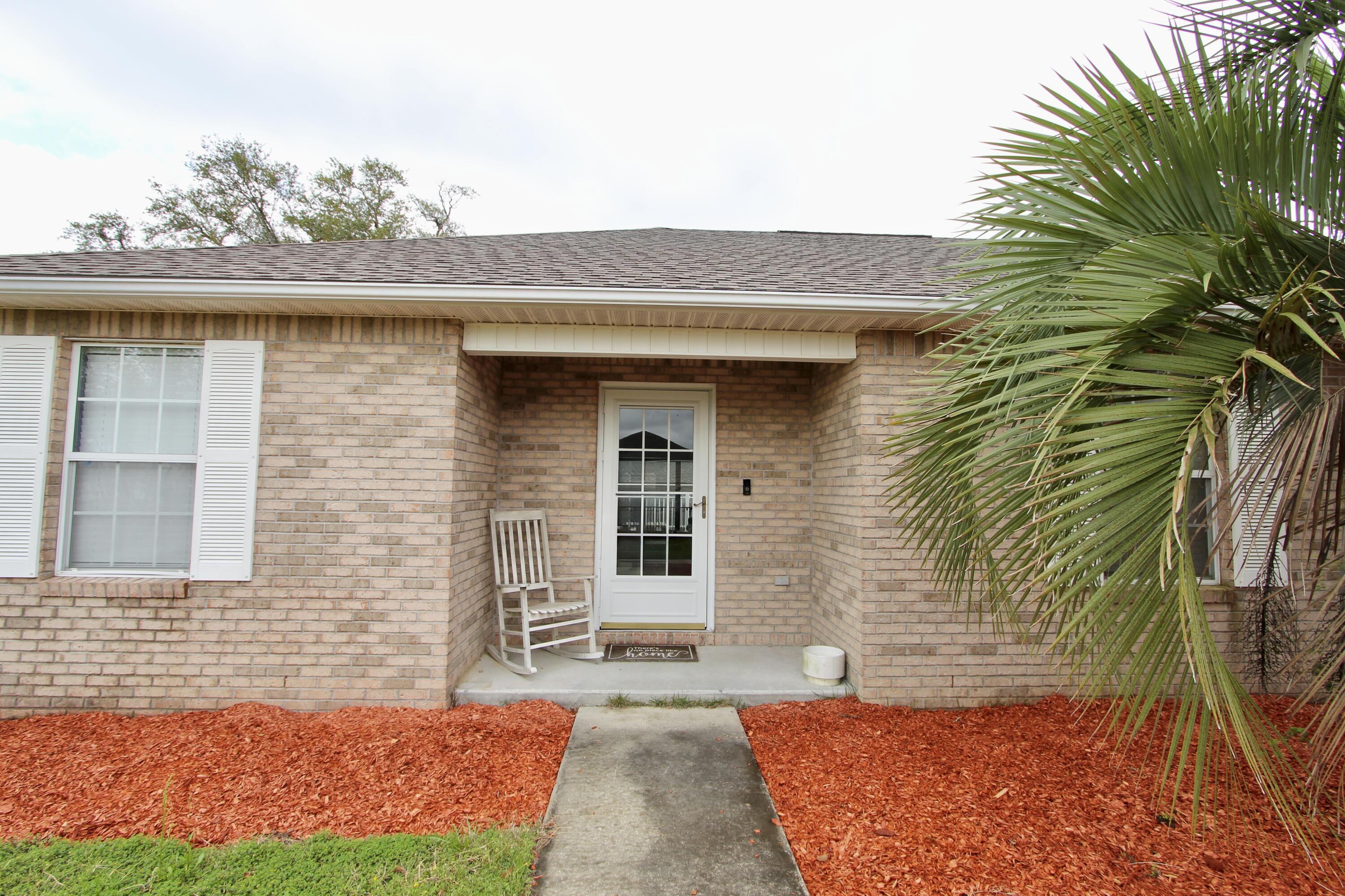 3150 Skyhawk Drive Crestview, FL 32539 - Photo 7 of 26 a front view of a house with a yard