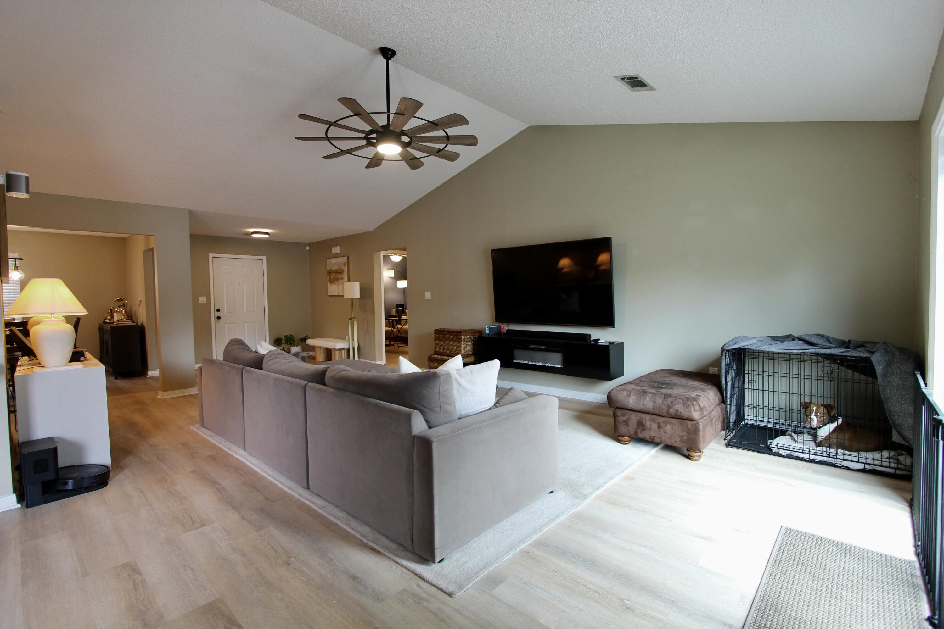 3150 Skyhawk Drive Crestview, FL 32539 - Photo 9 of 26 a living room with furniture and a flat screen tv