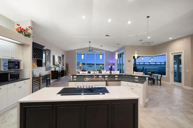 a large kitchen with a table and chairs