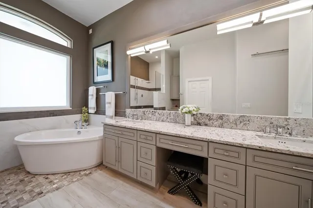 a bathroom with a sink and mirror