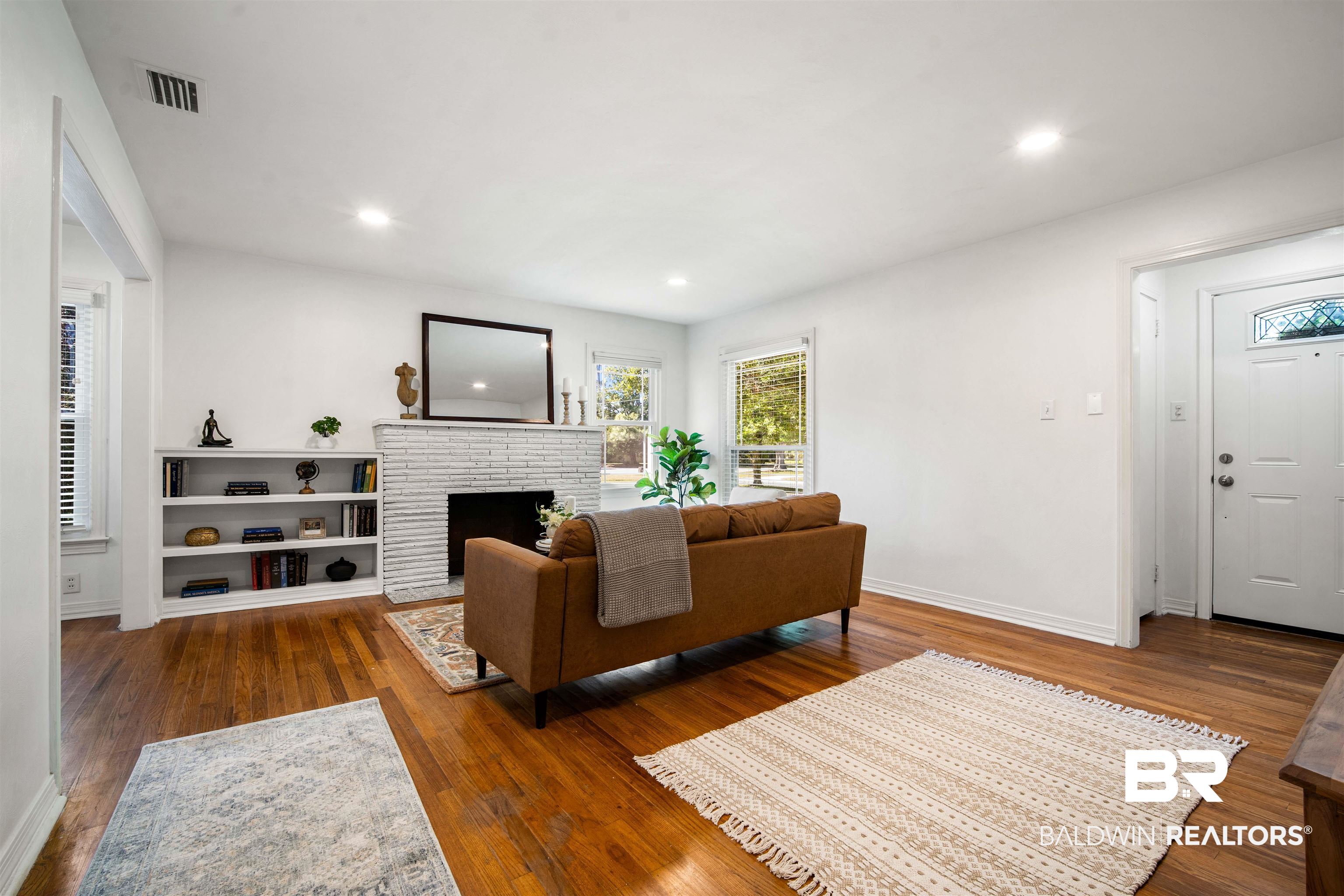 2615 Walton Avenue Mobile, AL 36606 - Photo 13 of 33 Living room with a fireplace, wood finished floors, visible vents, and recessed lighting
