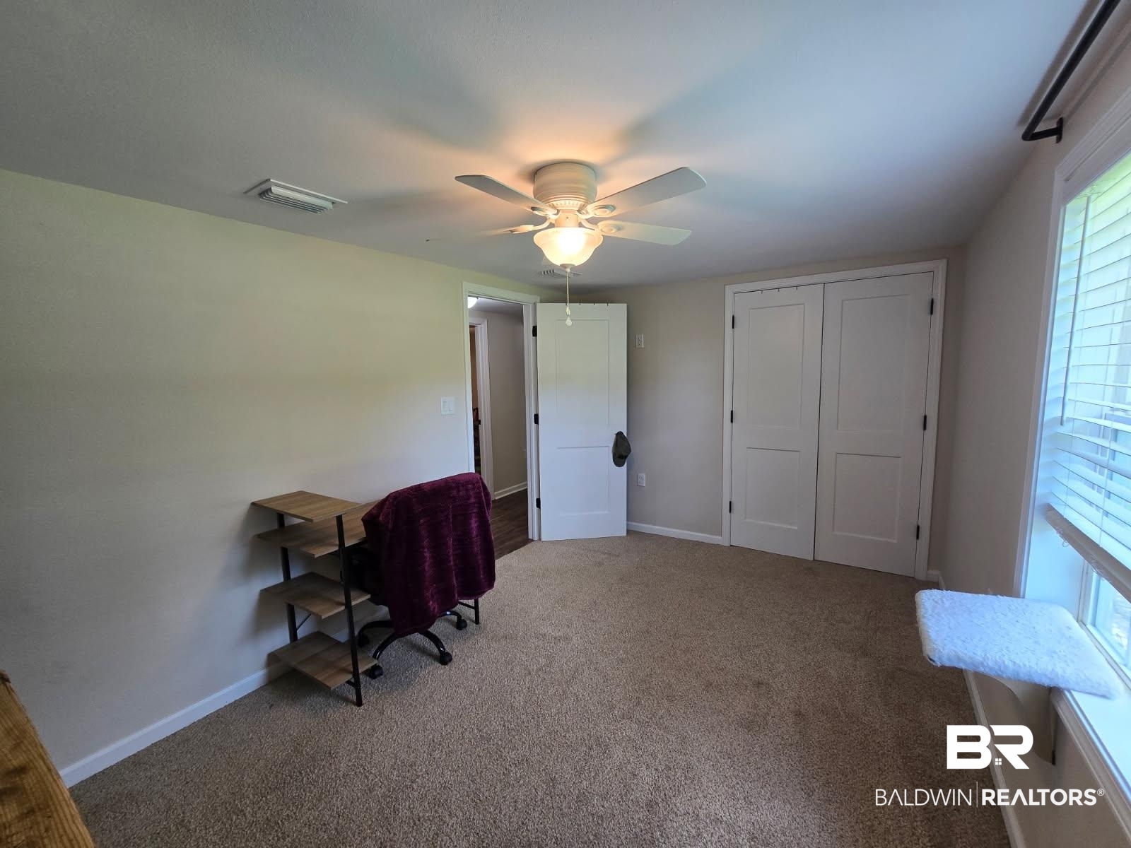 2534 Foshee Road Brewton, AL 36426 - Photo 7 of 16 Carpeted office space with baseboards, visible vents, and ceiling fan