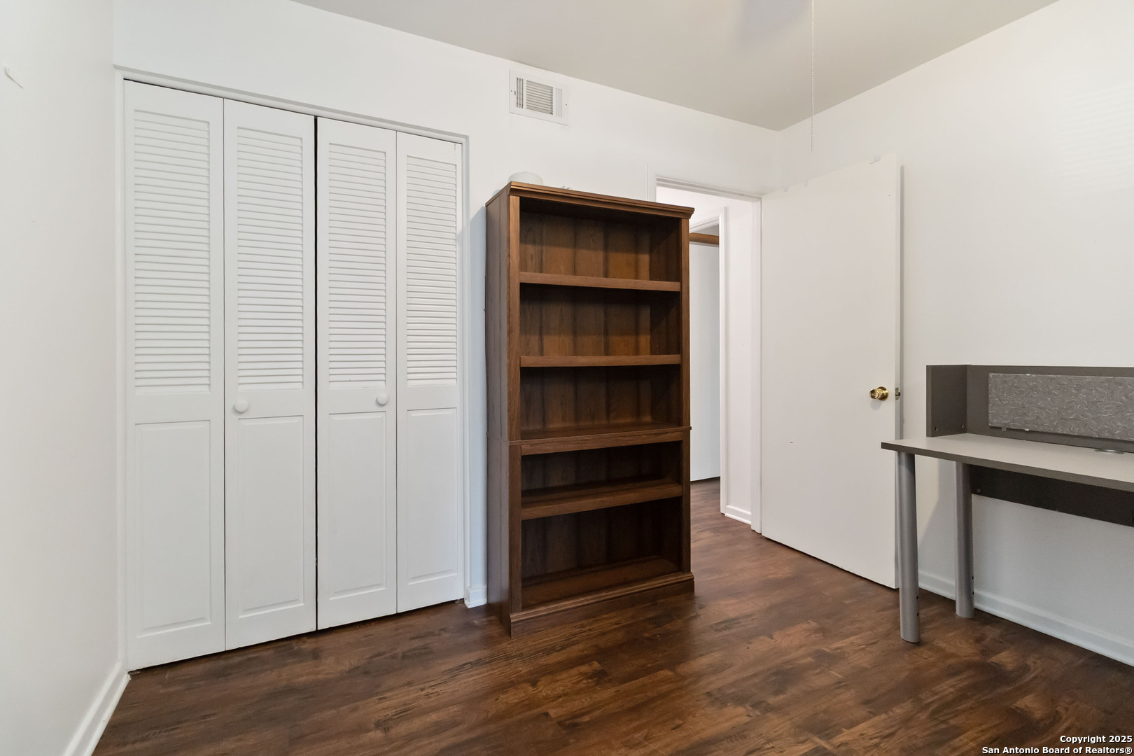 7903 Rimfire Drive San Antonio, TX 78227 - Photo 15 of 25 a view of an empty room with wooden floor and closet