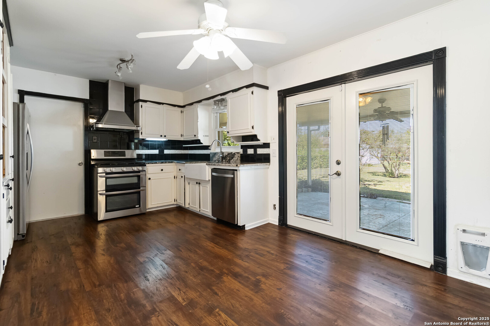 7903 Rimfire Drive San Antonio, TX 78227 - Photo 7 of 25 a kitchen with stainless steel appliances granite countertop a refrigerator and a stove top oven