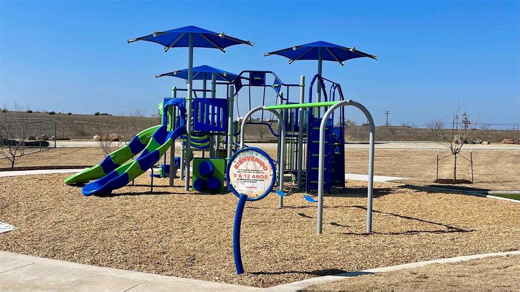 1922 Cherokee Lane Cleburne, TX 76033 - Photo 3 of 7 a view of a park with a slide