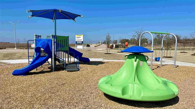 a view of a park with a slide