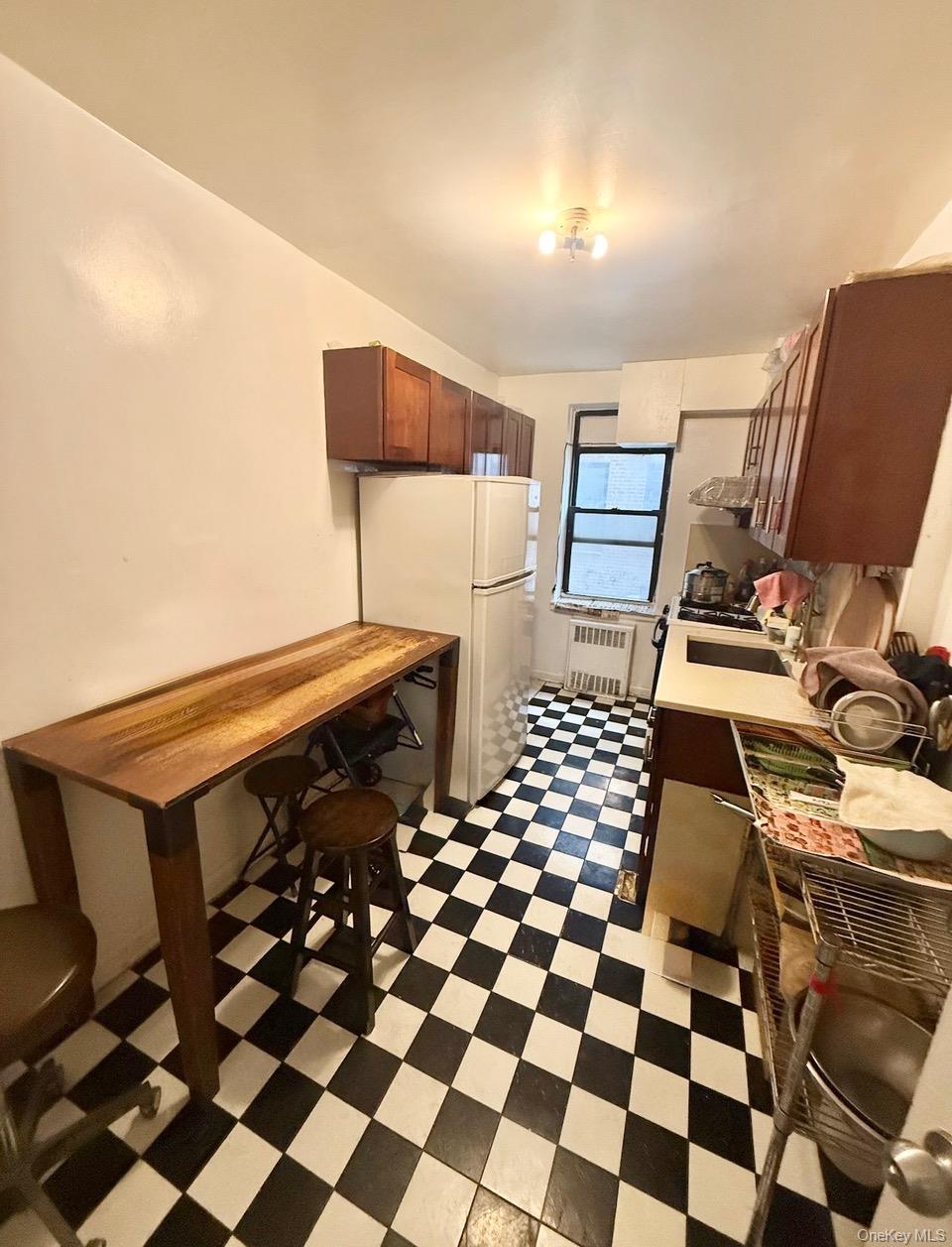43-40 Union Street, Unit 2D Queens, NY 11355 - Photo 4 of 5 a black and white checkered floor with a black white checkered floor