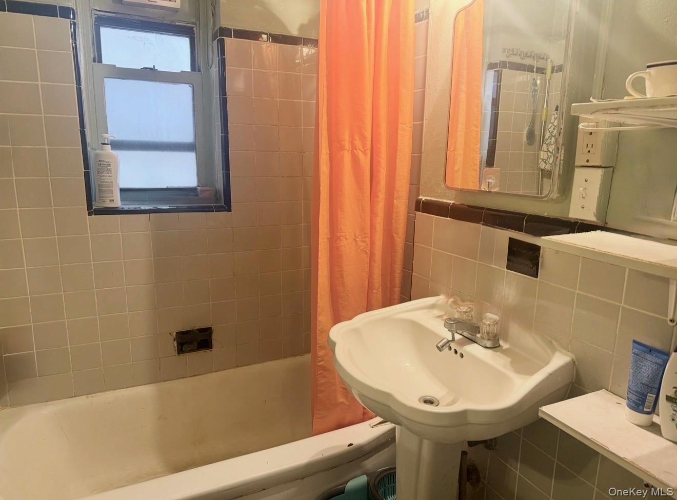 43-40 Union Street, Unit 2D Queens, NY 11355 - Photo 5 of 5 a bathroom with a sink and a mirror
