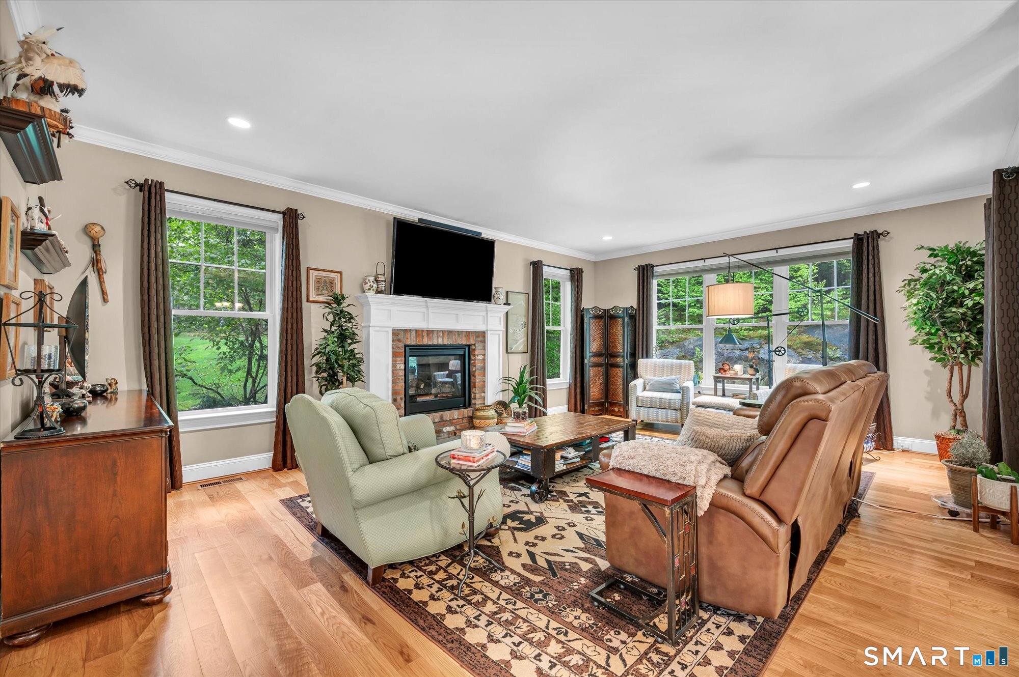 16 Sweetheart Mountain Road Canton, CT 06019 - Photo 9 of 40 a living room with furniture fireplace and a large window