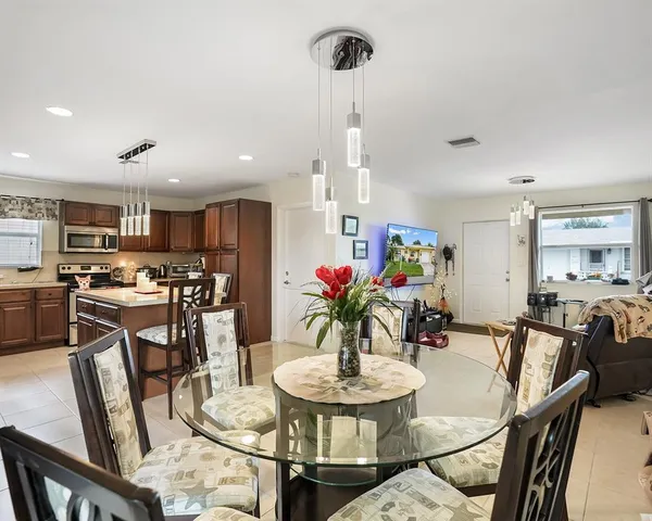 a view of a dining room with furniture and a table
