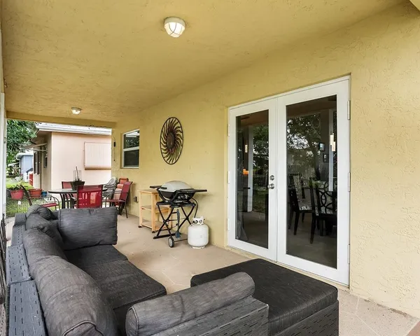 a living room with furniture and a window