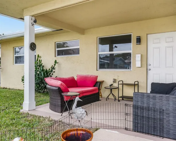 a outdoor living space with furniture and a couch
