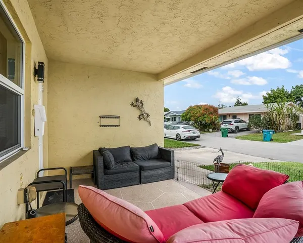 a rooftop view with patio outdoor seating