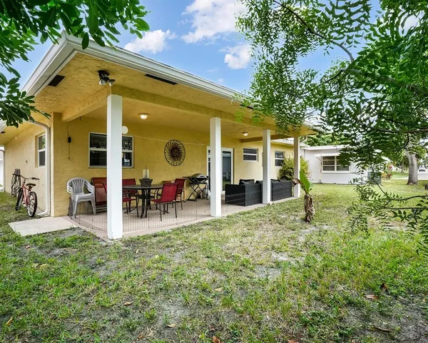 a front view of a house with patio
