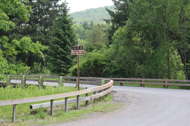a view of a chair and tables in the yard