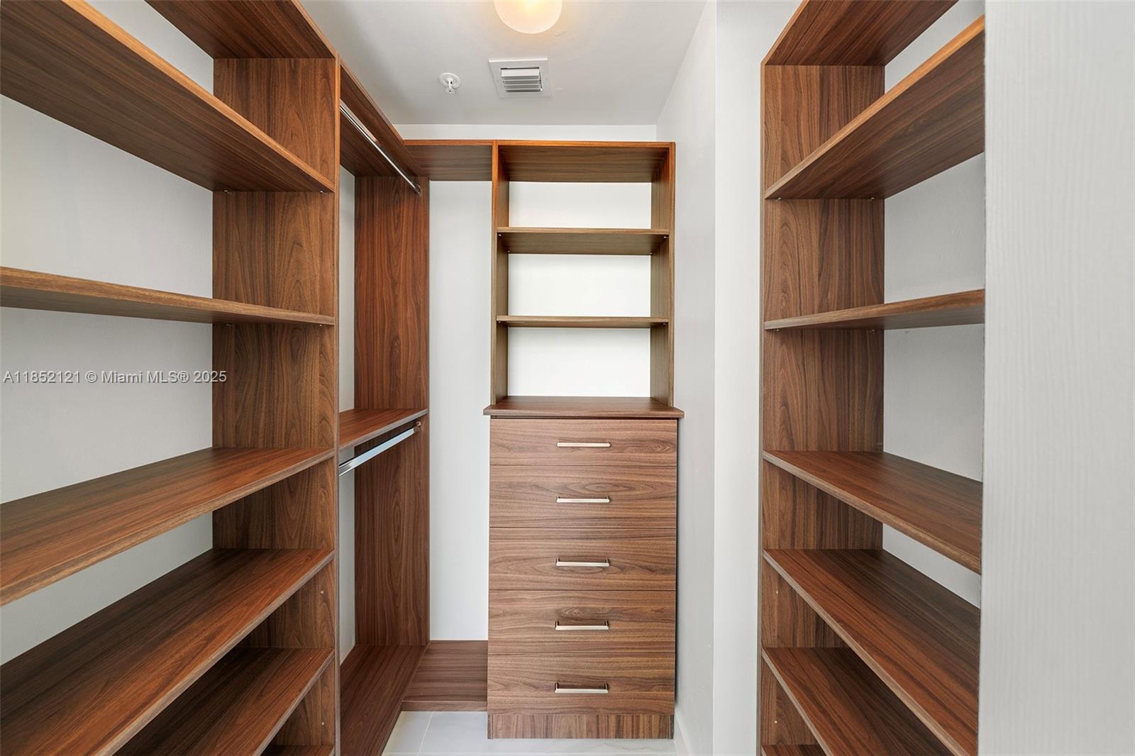 1155 Brickell Bay Drive, Unit 203 Miami, FL 33131 - Photo 18 of 36 a view of walk in closet