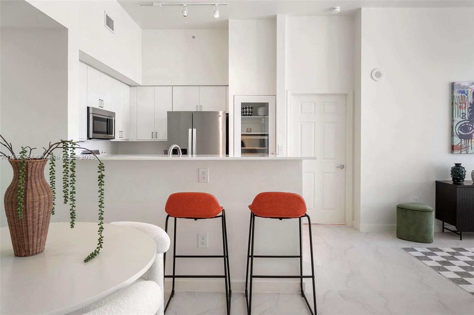 1155 Brickell Bay Drive, Unit 203 Miami, FL 33131 - Photo 2 of 36 a bathroom with a tub sink and mirror