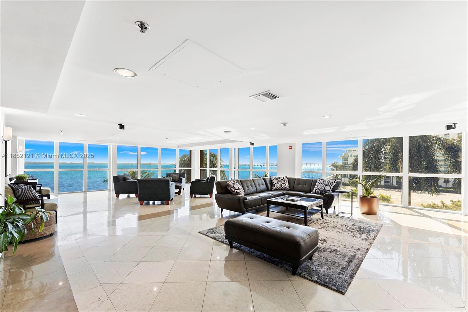 1155 Brickell Bay Drive, Unit 203 Miami, FL 33131 - Photo 24 of 36 a living room with furniture and a large window