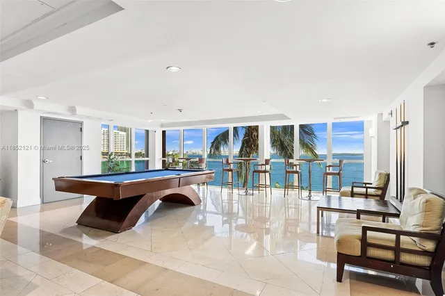 a room with lots of furniture and view of living room