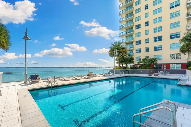 a view of a swimming pool with a lounge chair