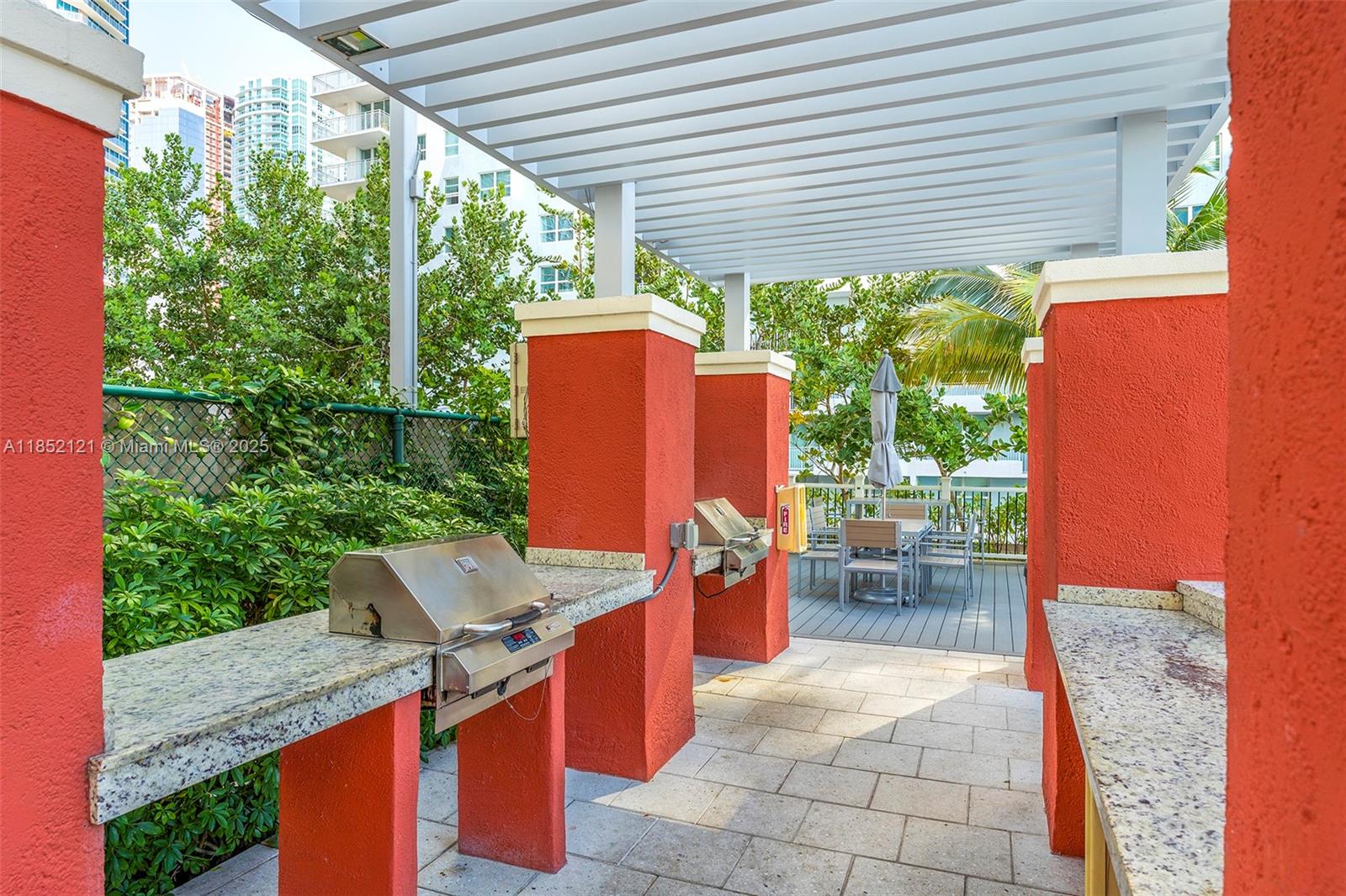 1155 Brickell Bay Drive, Unit 203 Miami, FL 33131 - Photo 30 of 36 a outdoor dining space with furniture