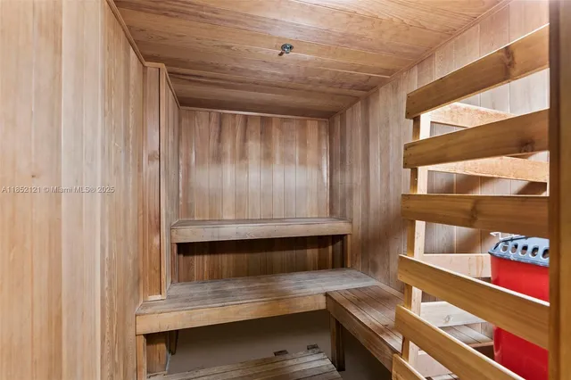 a view of room with stairs and furniture