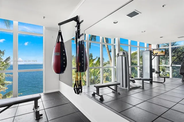 a very nice looking room with a large window and furniture