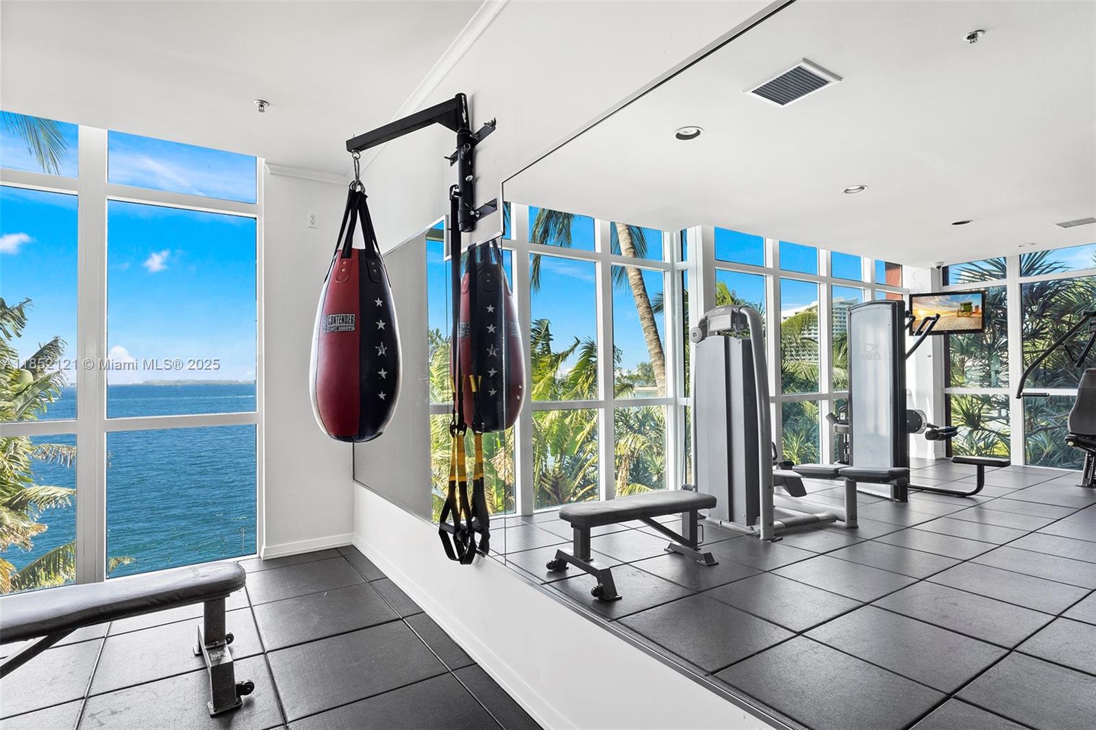 1155 Brickell Bay Drive, Unit 203 Miami, FL 33131 - Photo 34 of 36 a very nice looking room with a large window and furniture