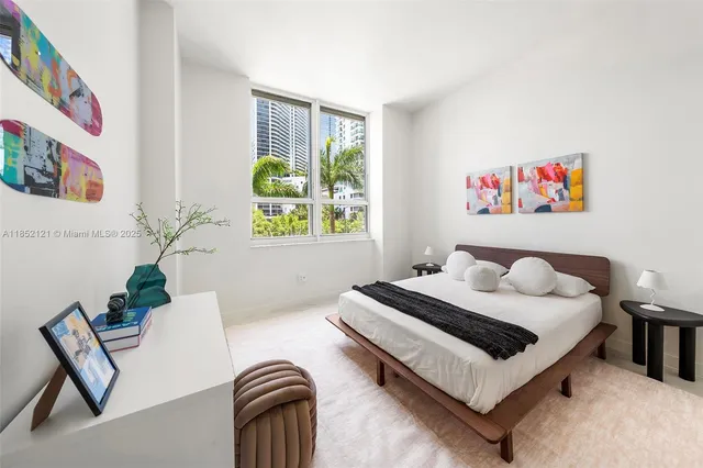 a bedroom with a bed and a couch