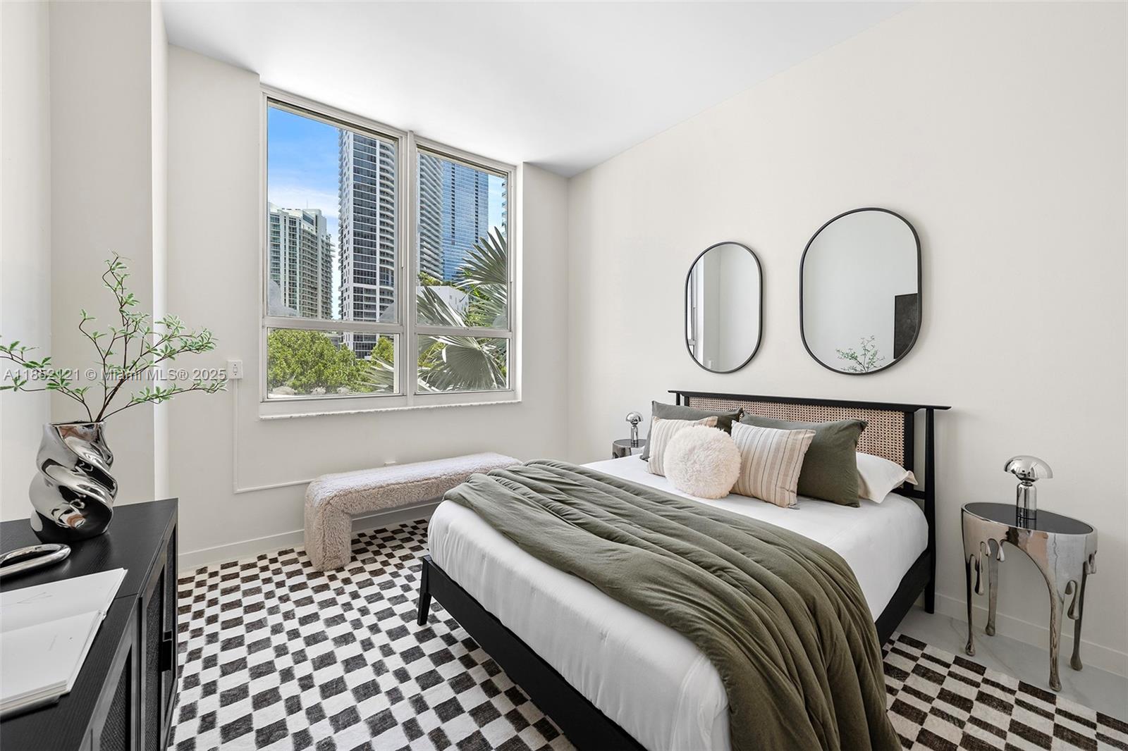 1155 Brickell Bay Drive, Unit 203 Miami, FL 33131 - Photo 5 of 36 a bedroom with bed and a window