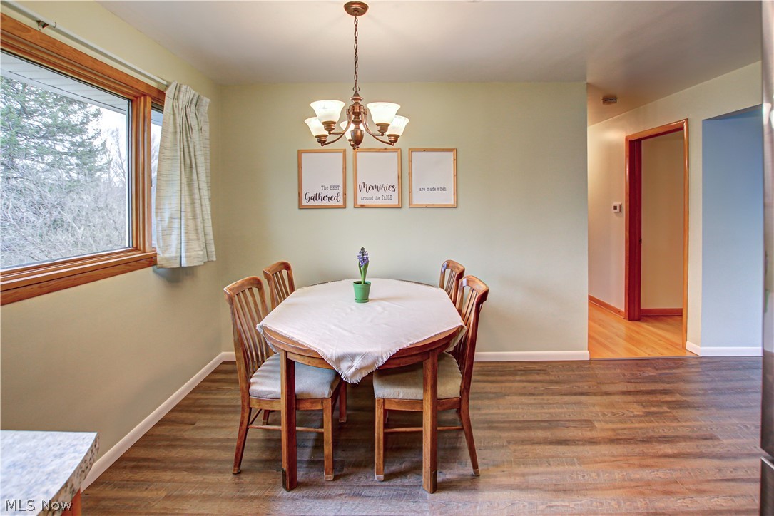 39974 Butternut Ridge Road Elyria, OH 44035 - Photo 8 of 40 Dining space with an inviting chandelier and hardwood / wood-style flooring