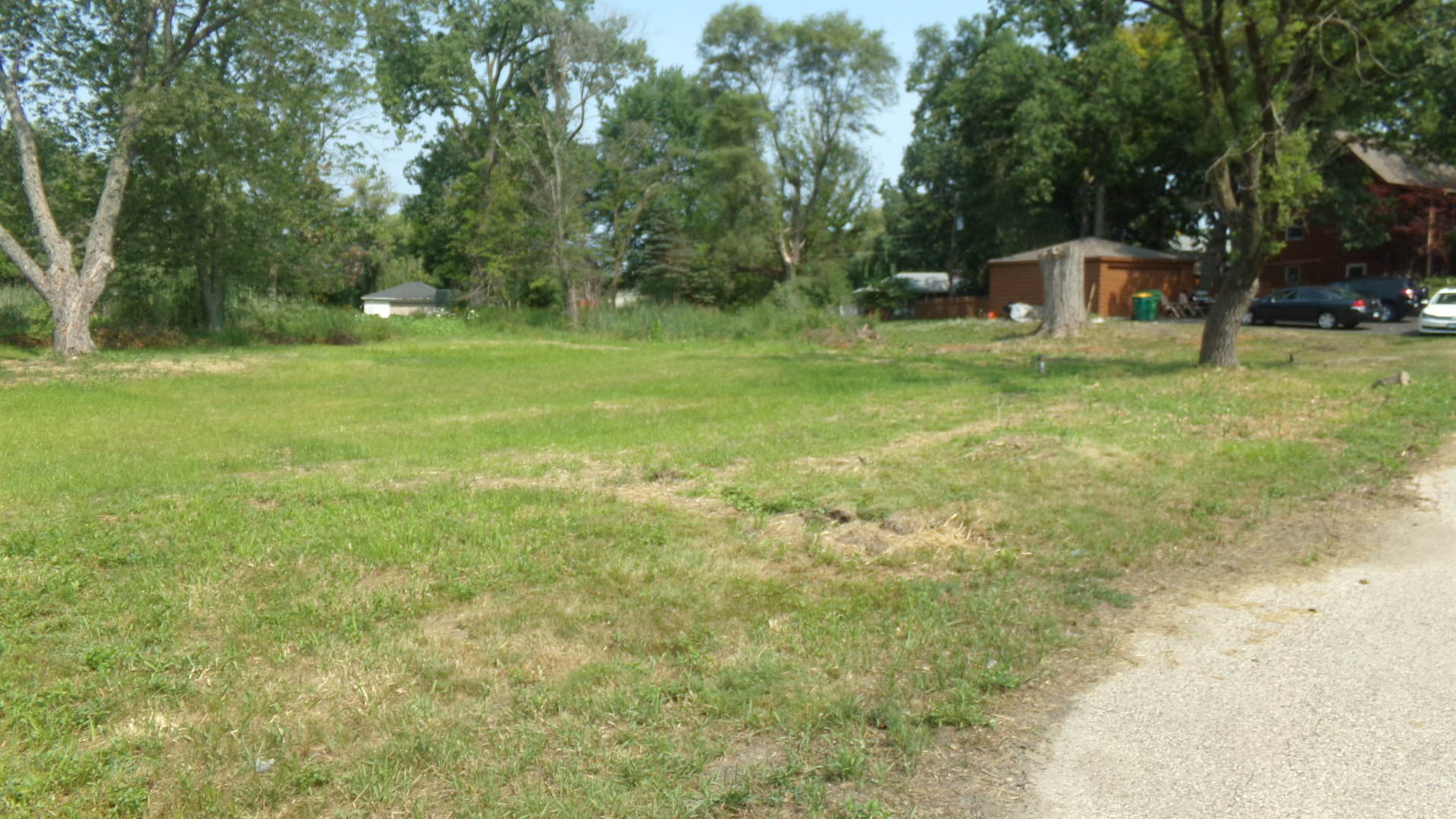 300 Knollwood Road Ingleside, IL 60041 - Photo 2 of 4 a view of a green field with trees in the background