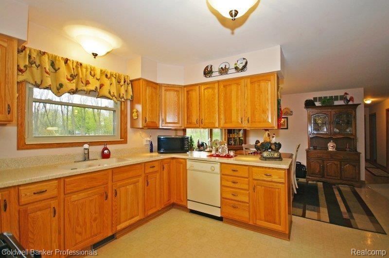 110 East Coon Lake Road Howell, MI 48843 - Photo 11 of 20 110 E Coon Lk - Kitchen 2.JPG