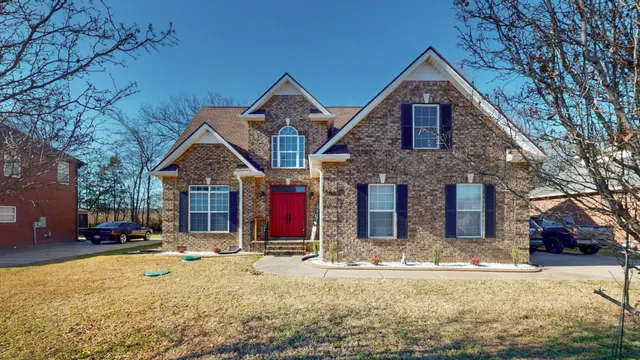 a front view of a house with a yard