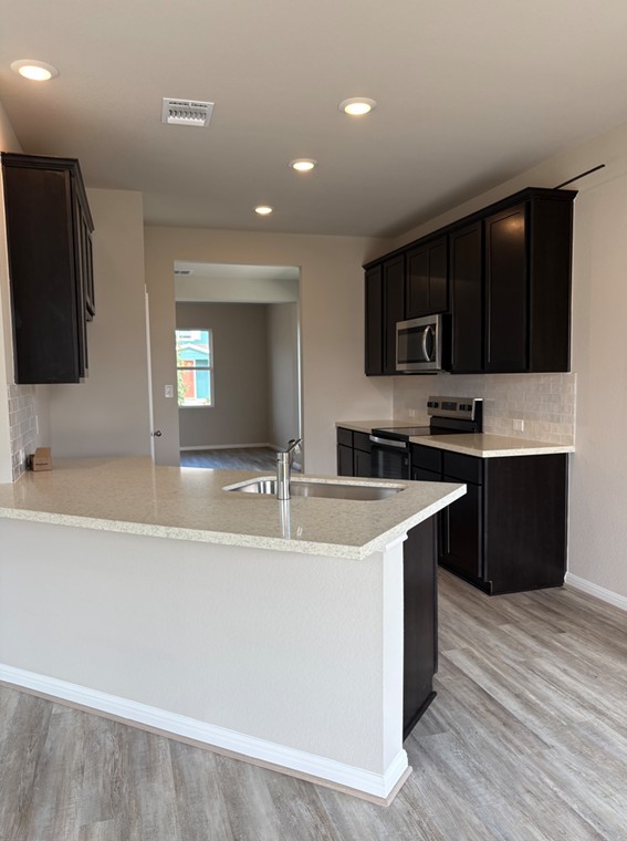 112 Elm Br Trail Taylor, TX 76574 - Photo 3 of 23 Light & Bright Open Concept Kitchen