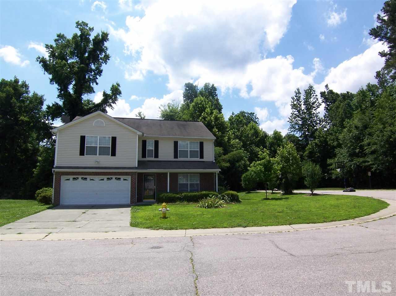 3904 Tyler Bluff Lane Raleigh, NC 27616 - Photo 1 of 13 a front view of a house with a garden