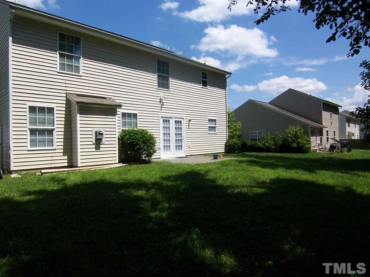 3904 Tyler Bluff Lane Raleigh, NC 27616 - Photo 11 of 13 a view of a house with a yard