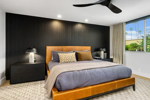 a bedroom with a bed and window