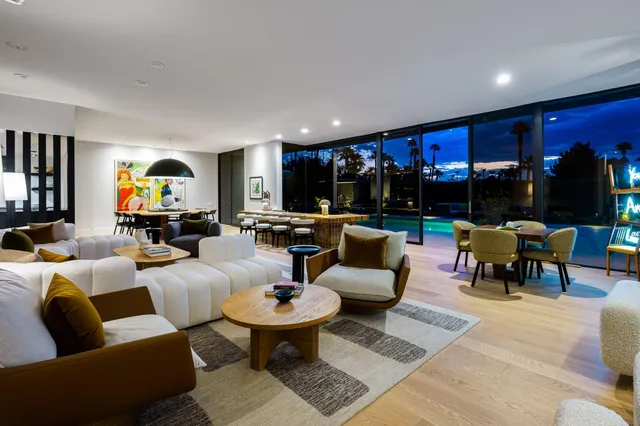 a view of swimming pool with outdoor seating