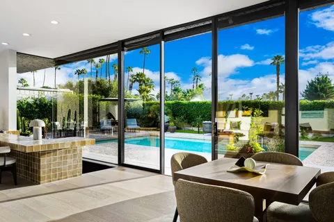 a view of a dining room with furniture window and outside view