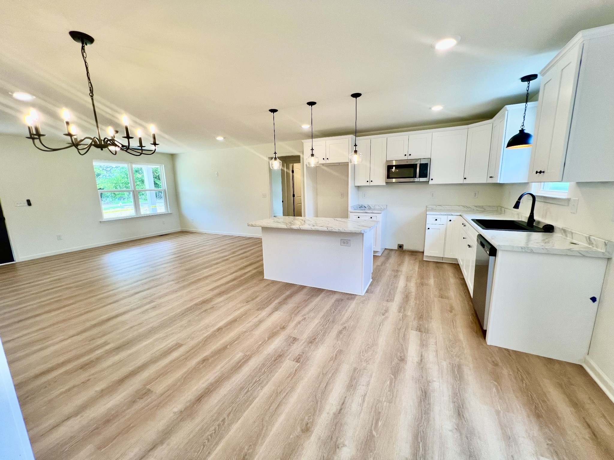 5712 Little Dry Creek Road Pulaski, TN 38478 - Photo 16 of 34 a view of a kitchen with kitchen island wooden floor center island and stainless steel appliances