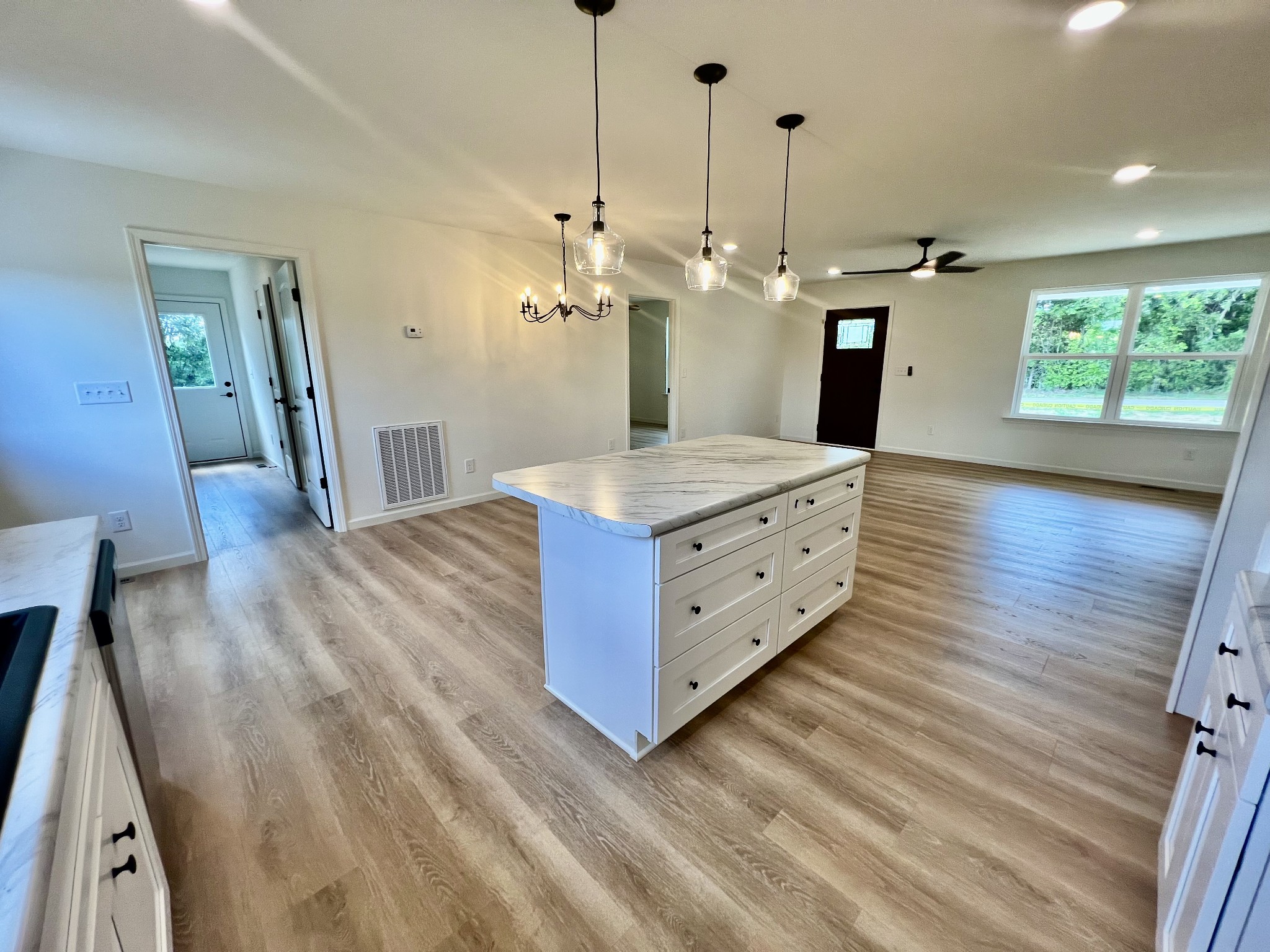5712 Little Dry Creek Road Pulaski, TN 38478 - Photo 20 of 34 a spacious bathroom with a granite countertop sink a mirror and shower view