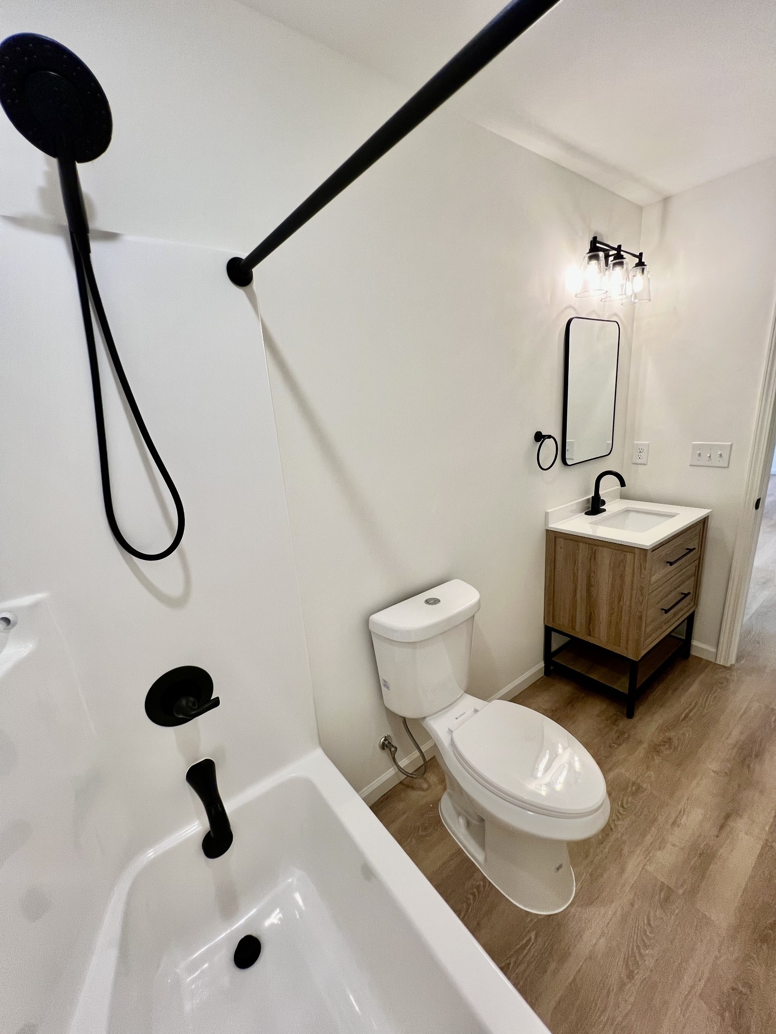 5712 Little Dry Creek Road Pulaski, TN 38478 - Photo 23 of 34 a bathroom with a sink a toilet and a mirror