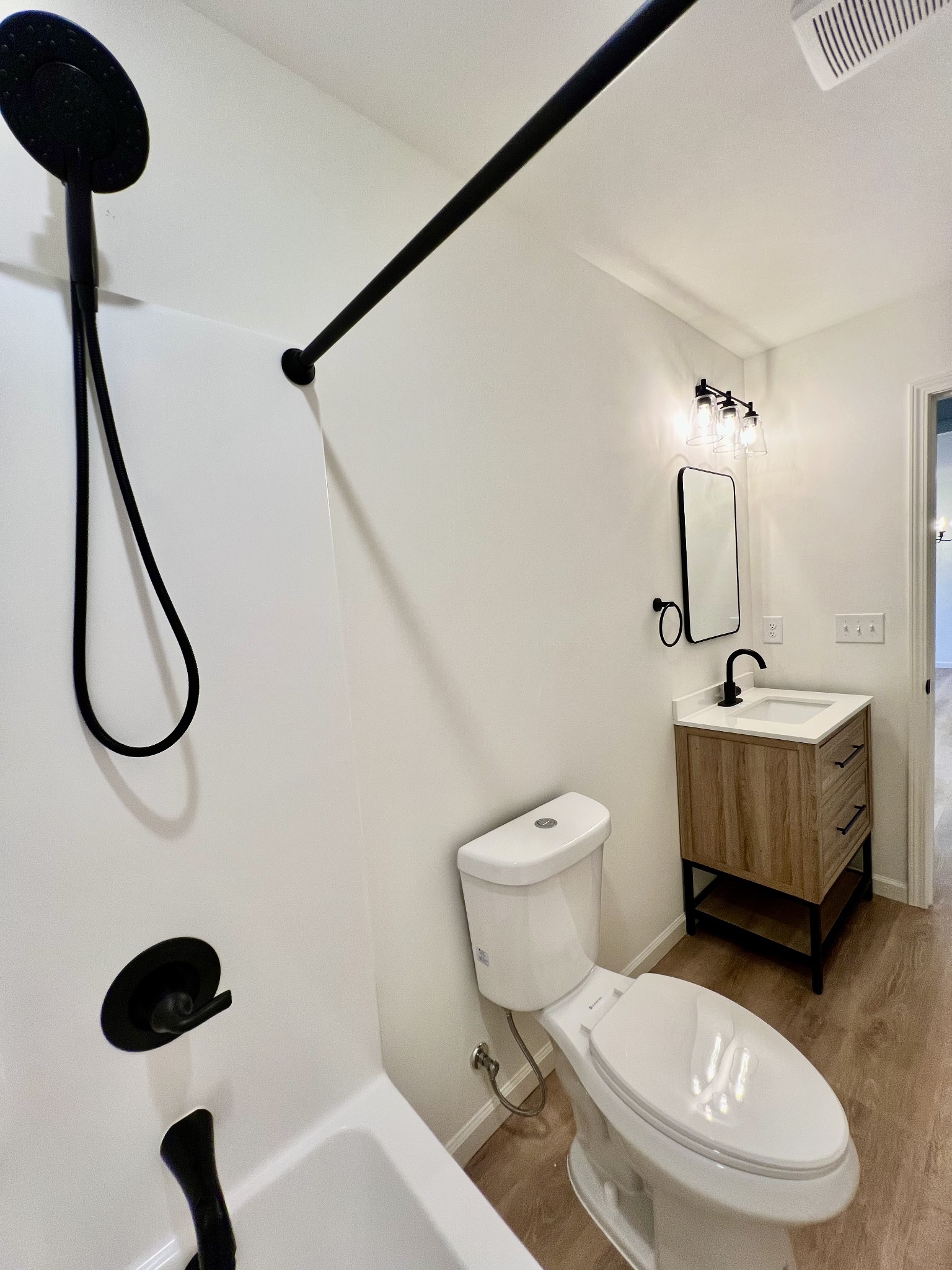 5712 Little Dry Creek Road Pulaski, TN 38478 - Photo 24 of 34 a bathroom with a toilet sink and mirror