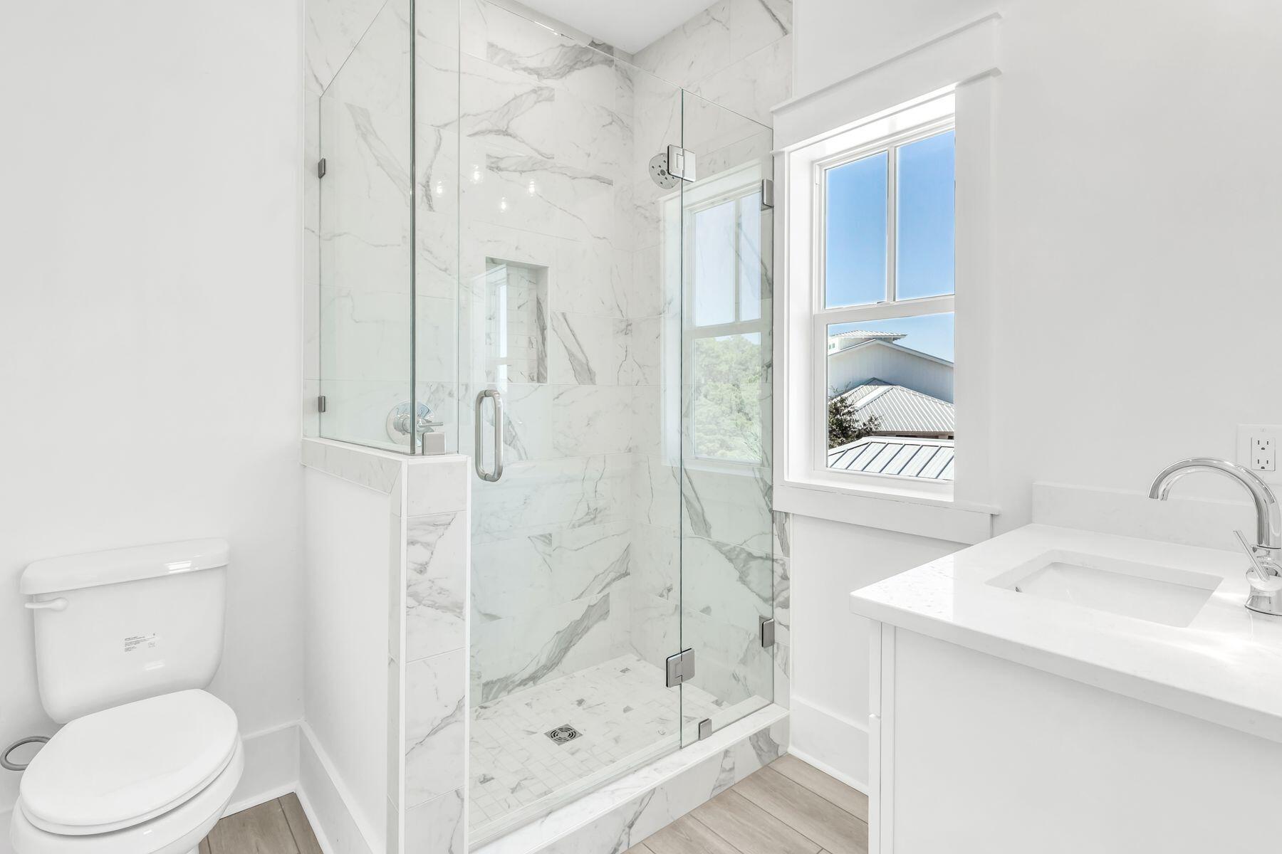 163 Beach Bike Way Inlet Beach Inlet Beach, FL 32461 - Photo 13 of 32 a bathroom with a shower a toilet and sink