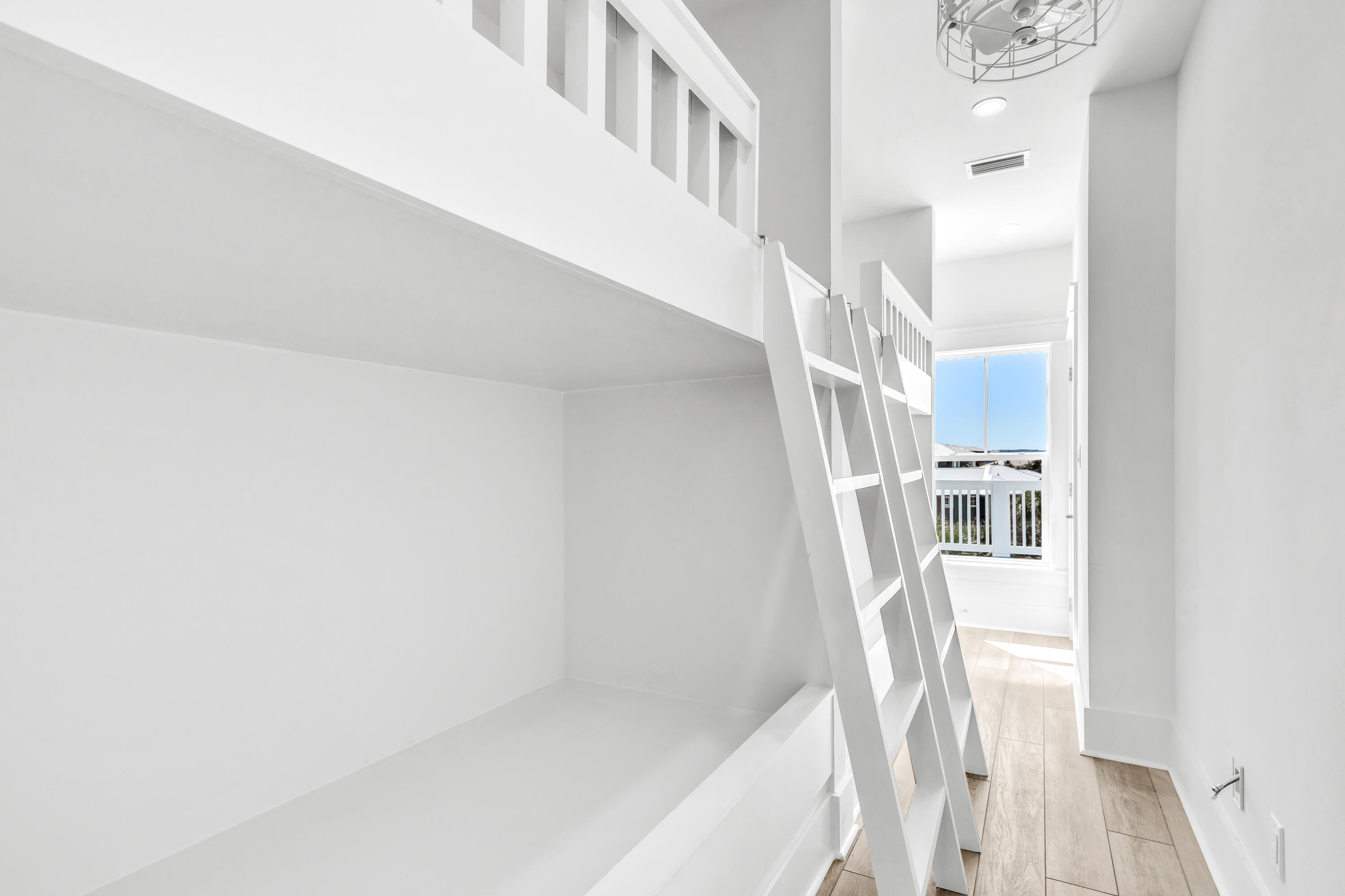 163 Beach Bike Way Inlet Beach Inlet Beach, FL 32461 - Photo 16 of 32 a view of staircase with white walls and a window
